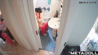 Brunette is in no hurry and sitting on the toilet