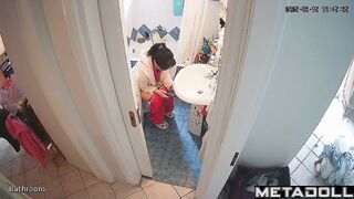 Brunette is in no hurry and sitting on the toilet
