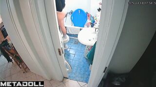 Slim brunette stood on the toilet to clean the ceiling