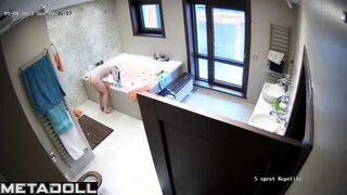 Lady bent down to wash her dark hair - bathroom tape