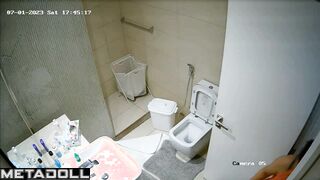 A secret lens records from behind the bathroom curtain