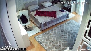 A seductive young beauty is walking around the room completely naked