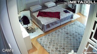 A seductive young beauty is walking around the room completely naked