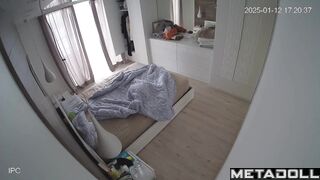 A blonde and her husband are looking at themselves naked in the mirror