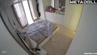 A blonde and her husband are looking at themselves naked in the mirror