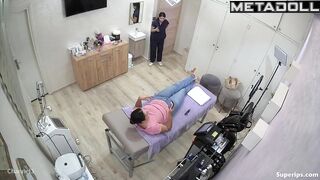 A young esthetician gently wipes the girl's wet pussy after the treatment