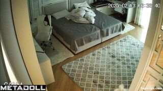 While changing clothes, the girl showed her small tits to a hidden camera