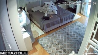 While changing clothes, the girl showed her small tits to a hidden camera