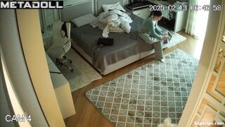While changing clothes, the girl showed her small tits to a hidden camera