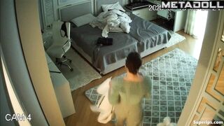 While changing clothes, the girl showed her small tits to a hidden camera