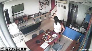 A sexy brunette gives her husband a blowjob right at the dining table
