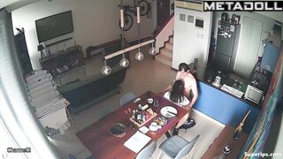A sexy brunette gives her husband a blowjob right at the dining table