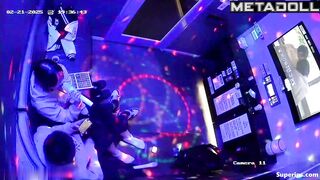 An Asian girl gives a shy guy a blowjob right in a karaoke lounge