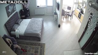 An excited guy pulls down his girlfriend's pants as she playfully resists