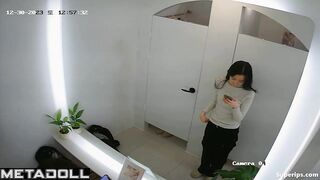 Cute Asian girls undress while trying on new clothes in the dressing room