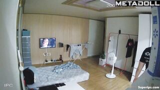 An Asian girl prepares her husband's dick for sex by giving him a blowjob