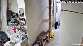 A chubby Asian girl walks around the apartment without panties