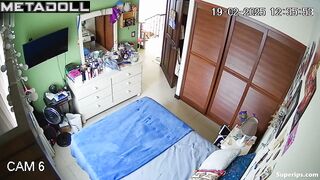 A young beauty is playing on her tablet while sitting naked on the bed