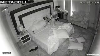 A seductive young girl grabs her husband's big penis as he gets into bed