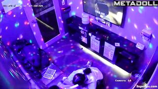 A guy is trying to sing karaoke while a cute Asian girl gives him a blowjob