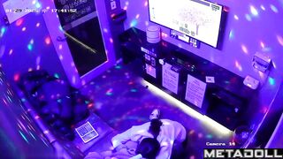 A guy is trying to sing karaoke while a cute Asian girl gives him a blowjob