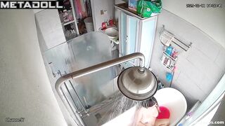 A chubby brunette caresses her hot pussy under the shower stream