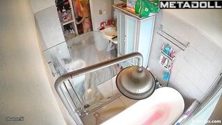 A chubby brunette caresses her hot pussy under the shower stream