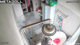 A chubby brunette caresses her hot pussy under the shower stream