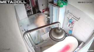 A chubby brunette caresses her hot pussy under the shower stream