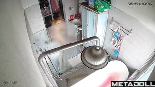 A chubby brunette caresses her hot pussy under the shower stream