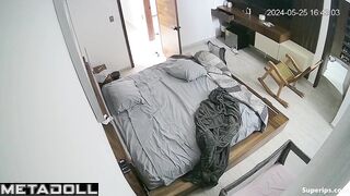 A young beauty plays with her wet pussy while watching porn on her phone