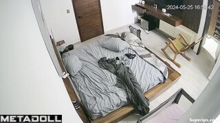 A young beauty plays with her wet pussy while watching porn on her phone