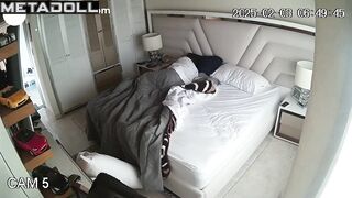 A sleepy brunette sits naked on the bed for a long time